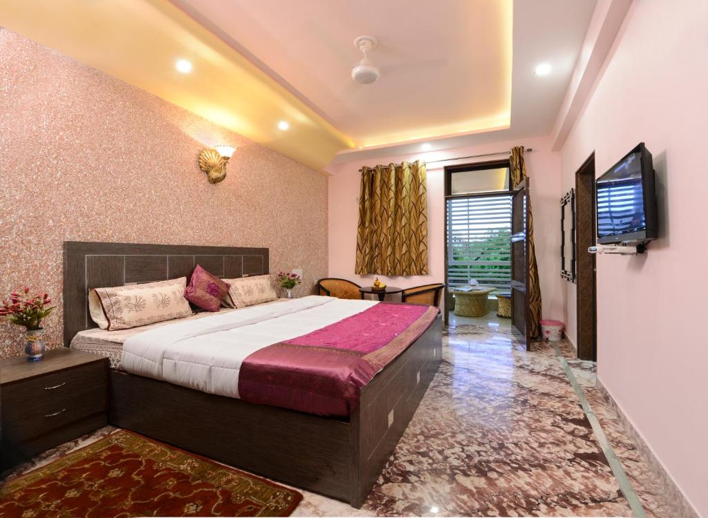 Postel nebo postele na pokoji v ubytování Rainbow Home Stay