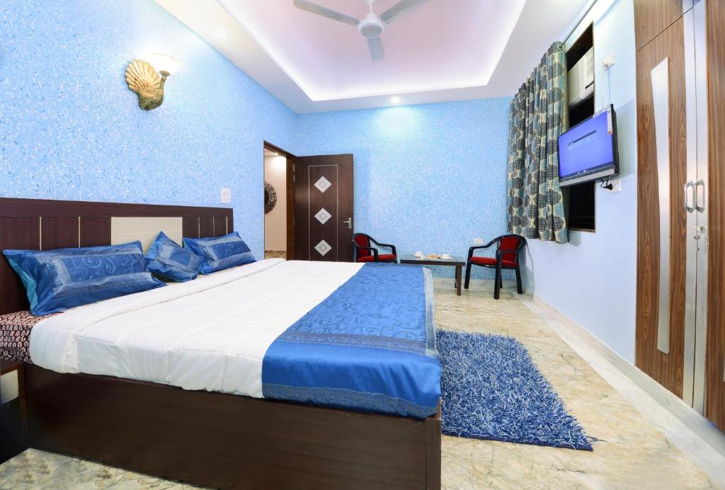 Postel nebo postele na pokoji v ubytování Rainbow Home Stay