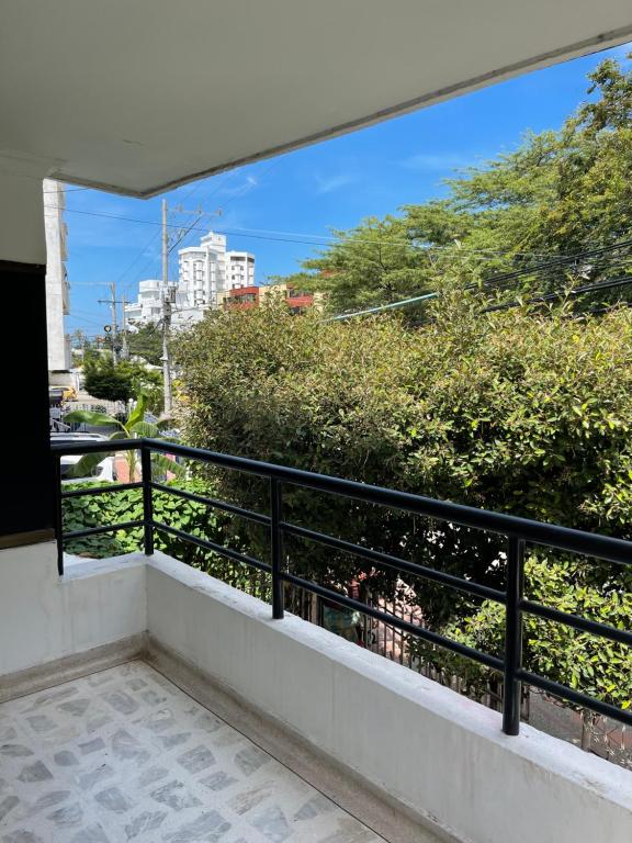 a balcony with a view of a city at Cabaña Gaia Rodadero in Santa Marta
