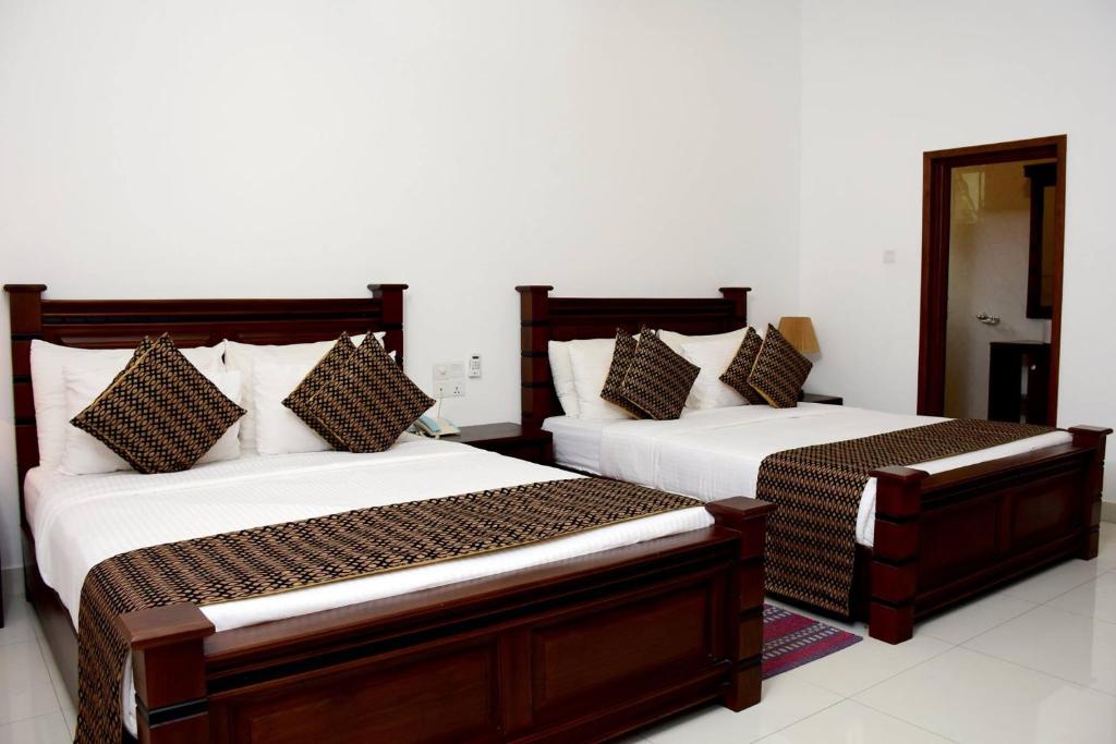 Postel nebo postele na pokoji v ubytování Hotel Bamiyan