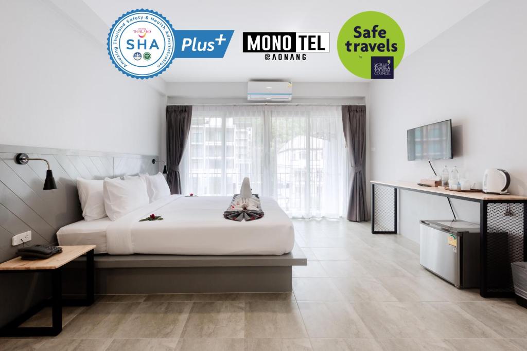 Postel nebo postele na pokoji v ubytování Monotel Aonang