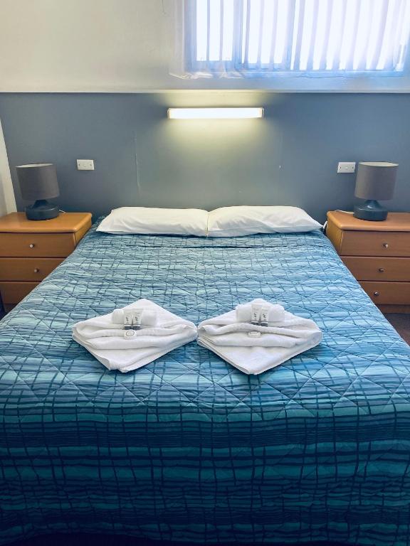 Postel nebo postele na pokoji v ubytování Barossa Gateway Motel