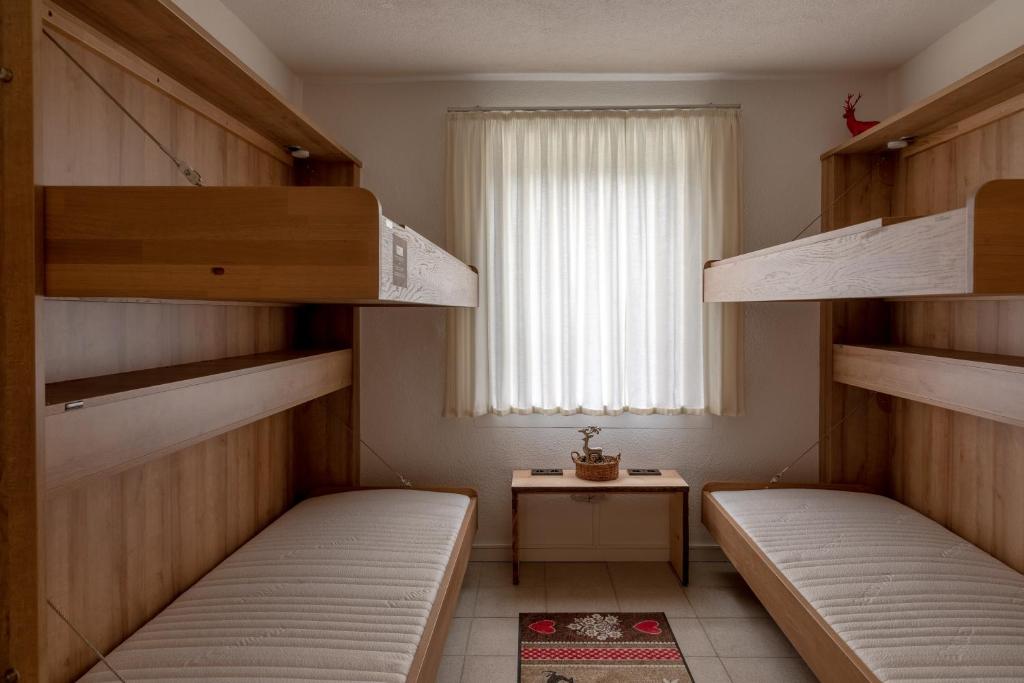 Posteľ alebo postele v izbe v ubytovaní Chalet Love The Alps by All in One Apartments