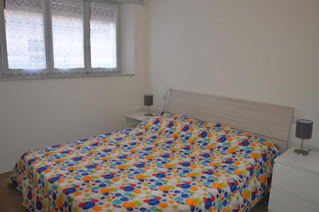 Posteľ alebo postele v izbe v ubytovaní Ester a soli 150m. dal mare