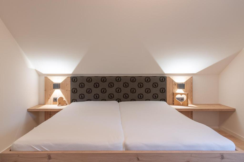 Posteľ alebo postele v izbe v ubytovaní Chalet Love The Alps by All in One Apartments