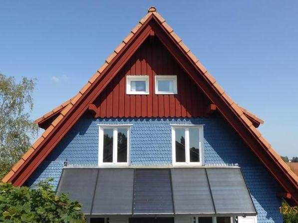 a blue house with a red roof at Das blaue Haus in Pfullendorf