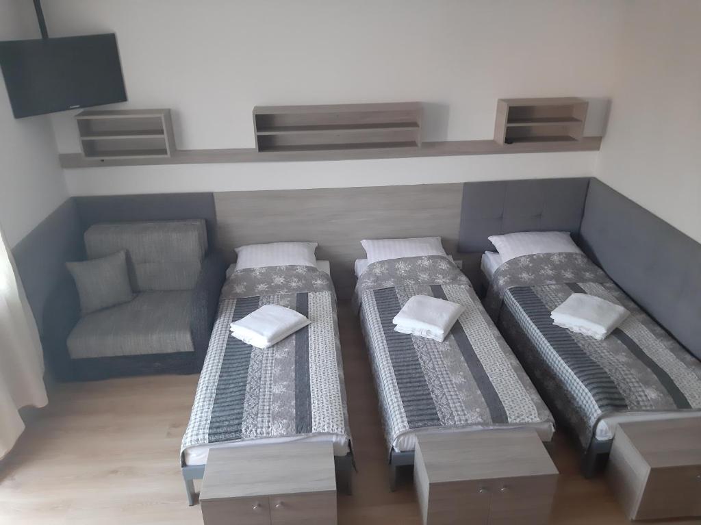 Posteľ alebo postele v izbe v ubytovaní Tasarz Spa Ośrodek Wczasowy
