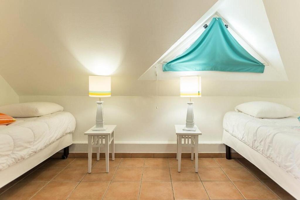 Postel nebo postele na pokoji v ubytování Résidence Les Ilets - maeva Home