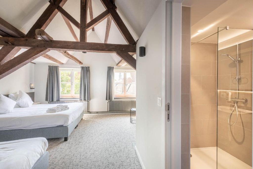 Postel nebo postele na pokoji v ubytování Hotel Augustyn Brugge
