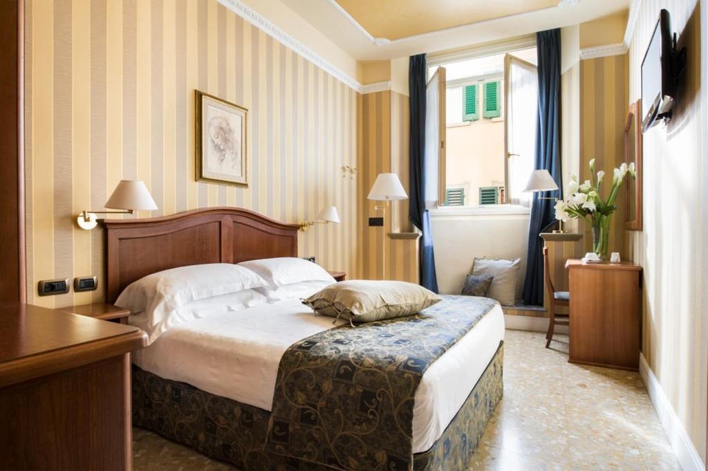 Postel nebo postele na pokoji v ubytování Hotel Silla