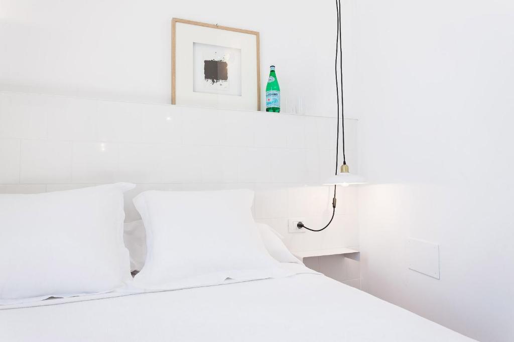 Posteľ alebo postele v izbe v ubytovaní Hostal Argo