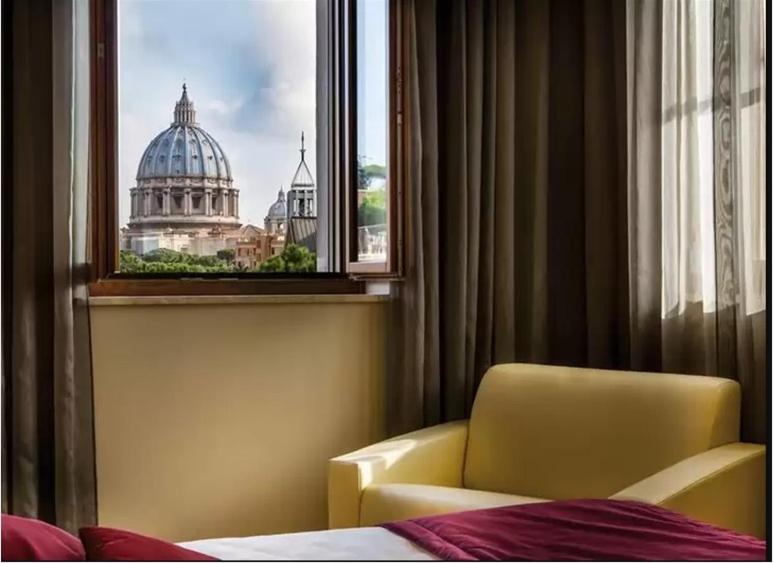 Łóżko lub łóżka w pokoju w obiekcie Hotel Il Cantico St. Peter
