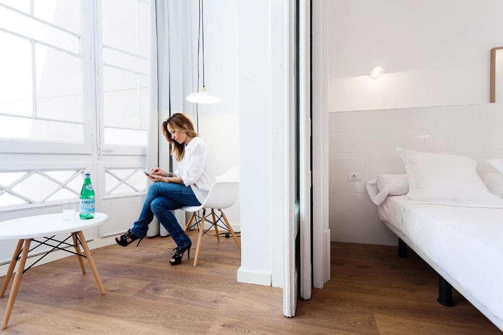 Posteľ alebo postele v izbe v ubytovaní Hostal Argo