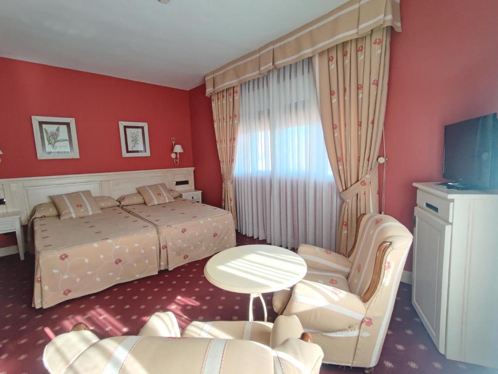 TV a/nebo společenská místnost v ubytování Hotel Leonor Mirón