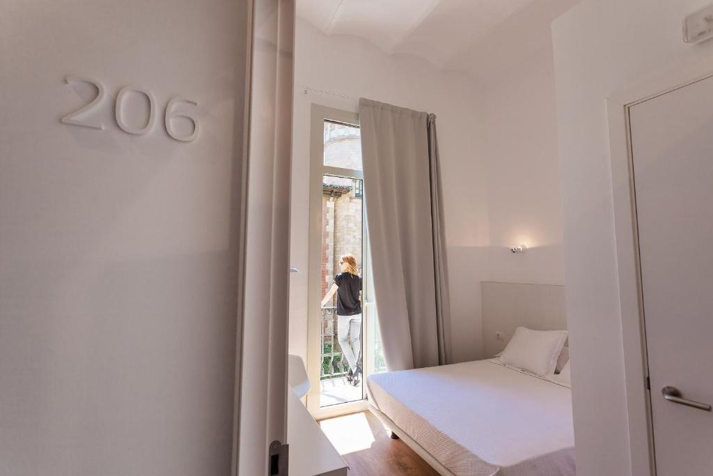 Posteľ alebo postele v izbe v ubytovaní Hostal Argo