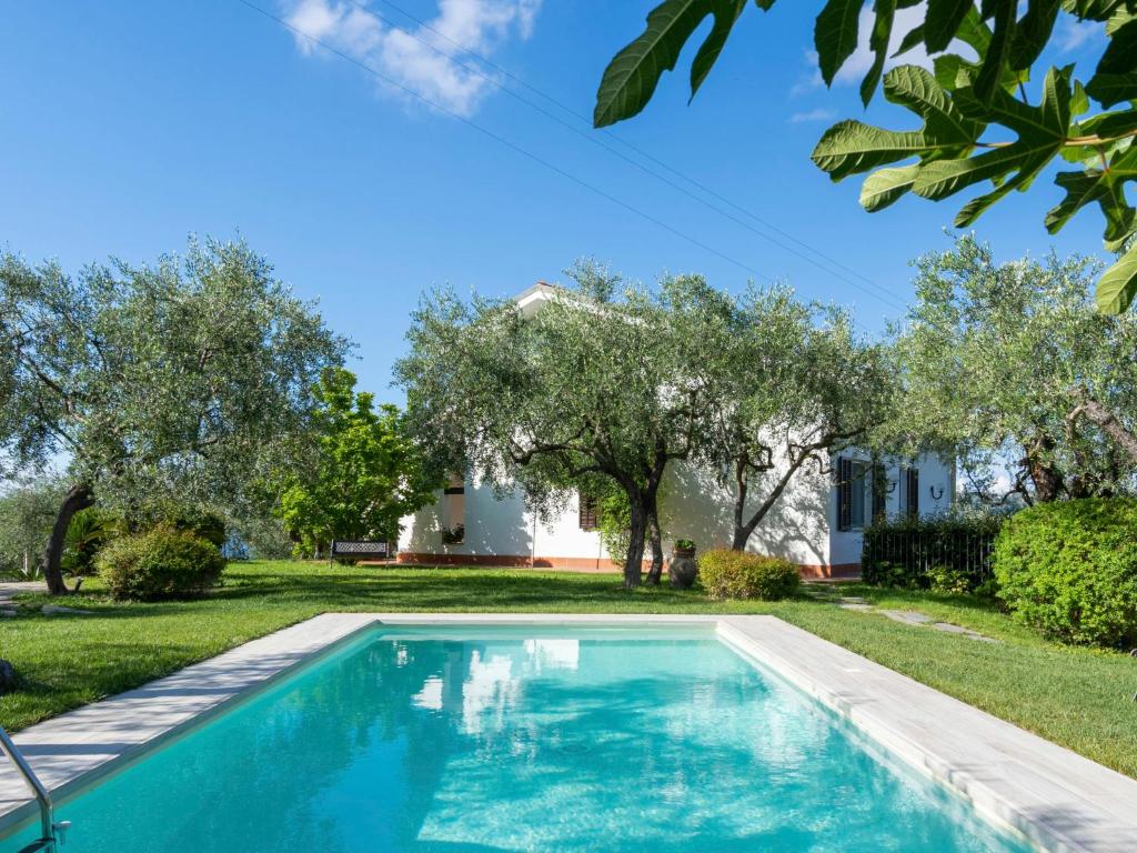 a swimming pool in the yard of a house at Apartment Alberto B by Interhome in Diano Castello
