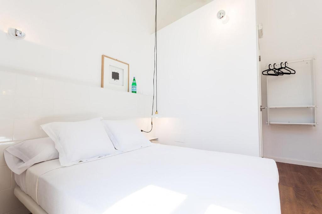 Posteľ alebo postele v izbe v ubytovaní Hostal Argo