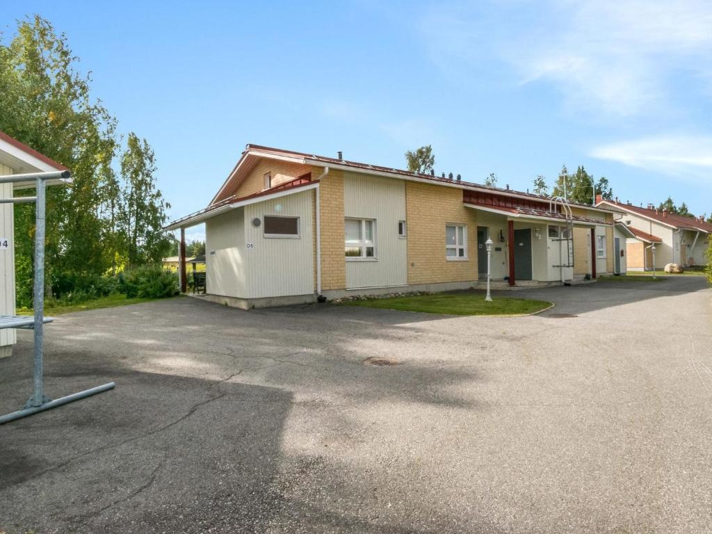 an empty parking lot in front of a building at Holiday Home Prokatti by Interhome in Lahdenperä