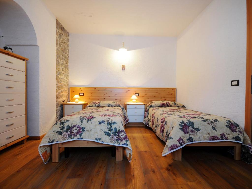 Posteľ alebo postele v izbe v ubytovaní Apartment Maso Marini - Appartamento Capriolo by Interhome