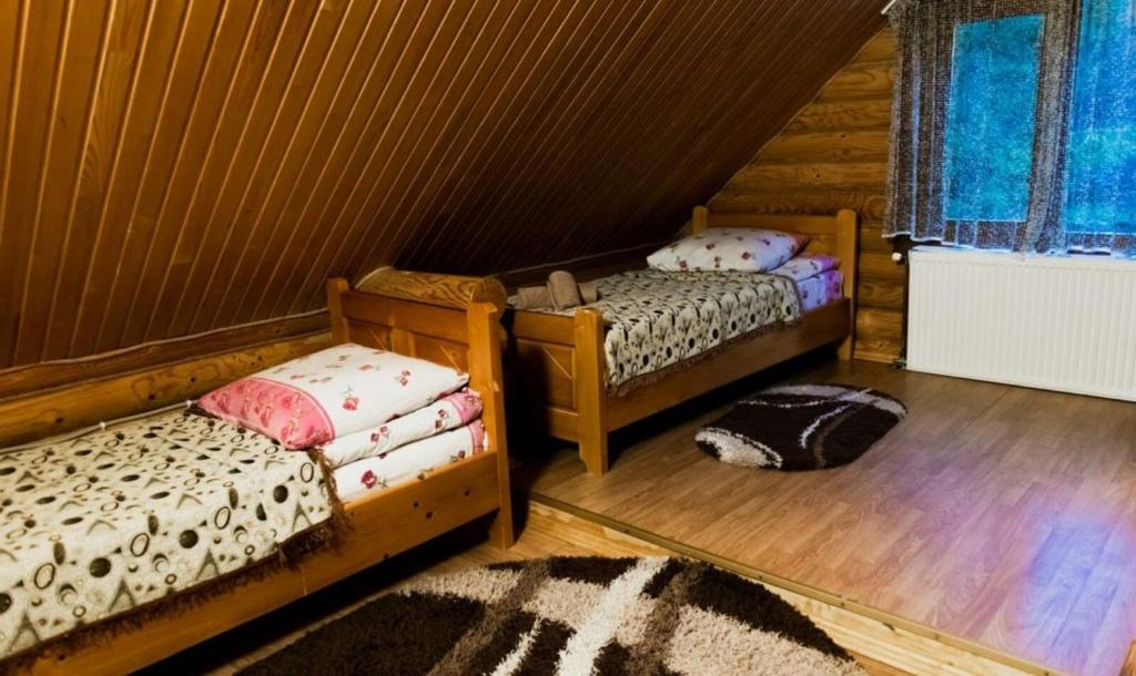 Postel nebo postele na pokoji v ubytování Шепіт Карпат