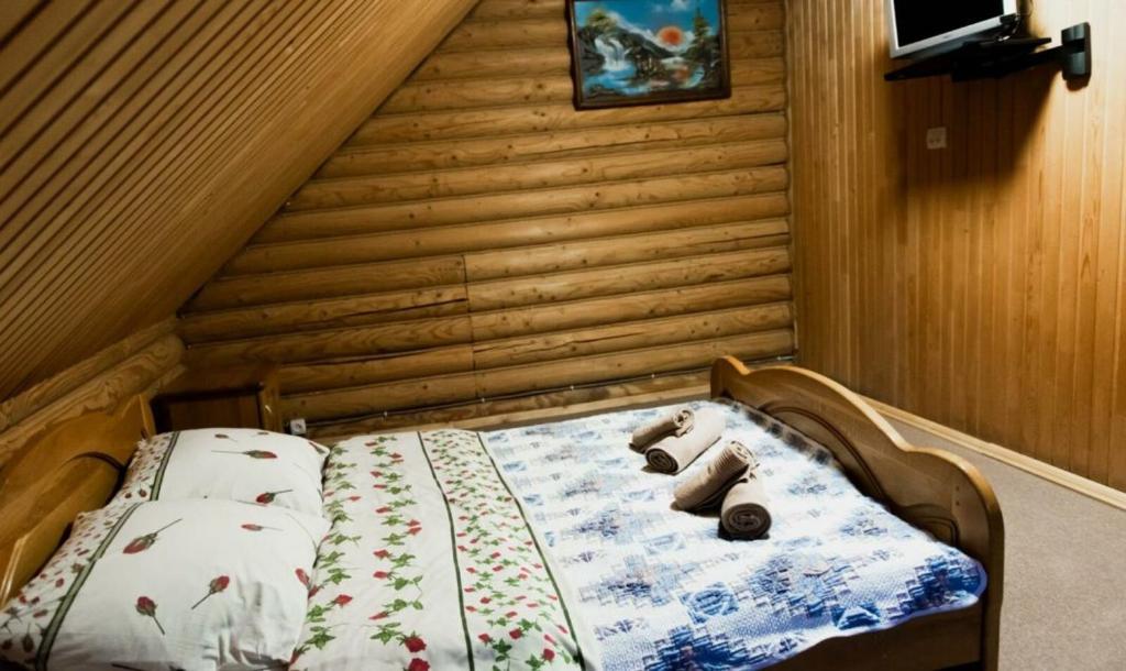 Postel nebo postele na pokoji v ubytování Шепіт Карпат