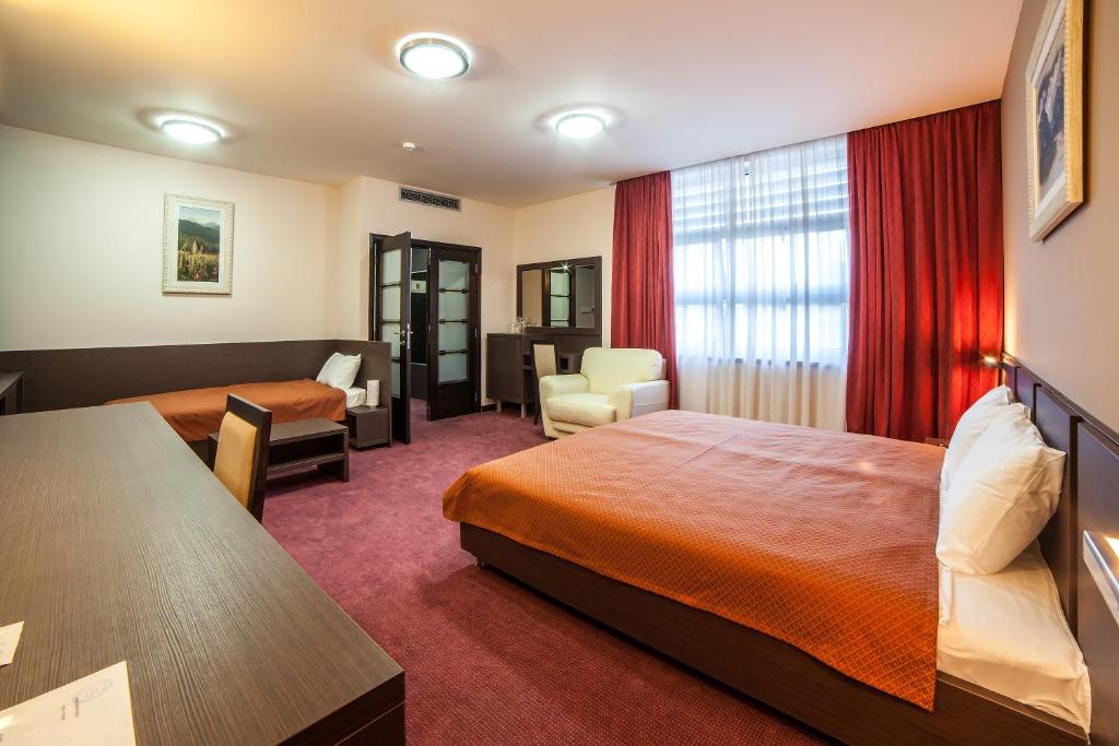 Postel nebo postele na pokoji v ubytování Hotel Terminus