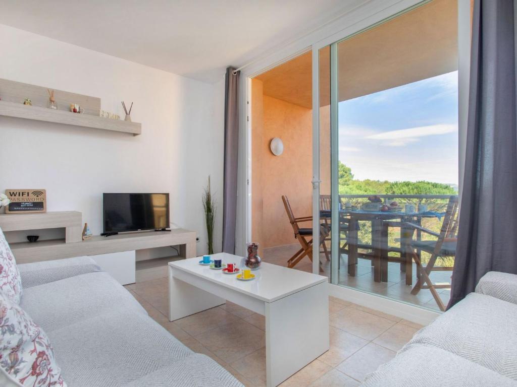 Televízia a/alebo spoločenská miestnosť v ubytovaní Apartment Ca la Marisa by Interhome