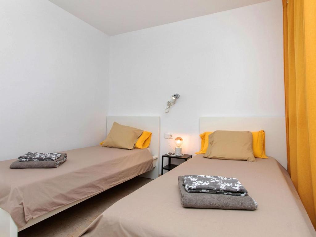 Posteľ alebo postele v izbe v ubytovaní Apartment Ca la Marisa by Interhome