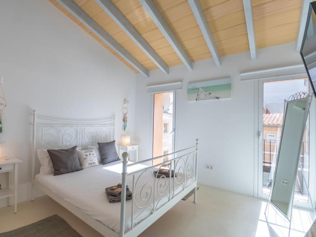 Postel nebo postele na pokoji v ubytování Holiday Home Can Regalat by Interhome
