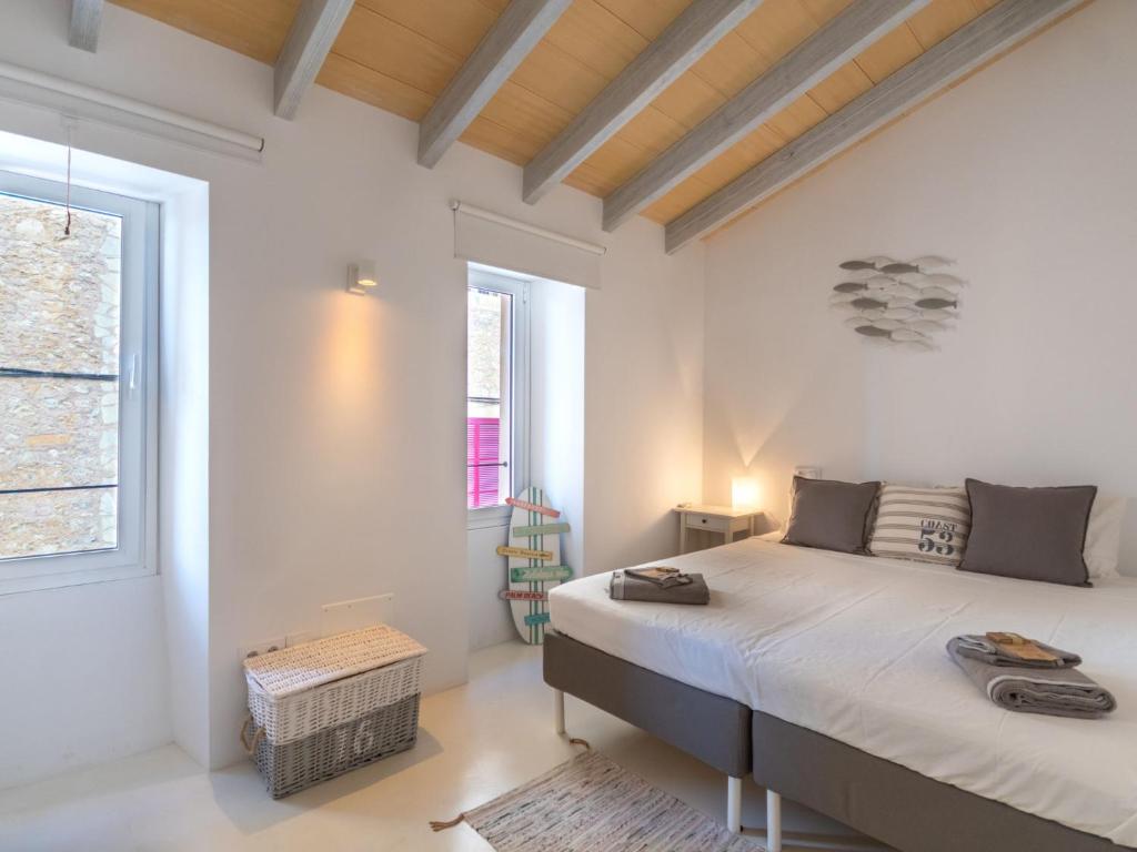Postel nebo postele na pokoji v ubytování Holiday Home Can Regalat by Interhome