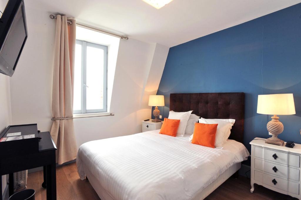 Кровать или кровати в номере Hotel Le Rayon Vert