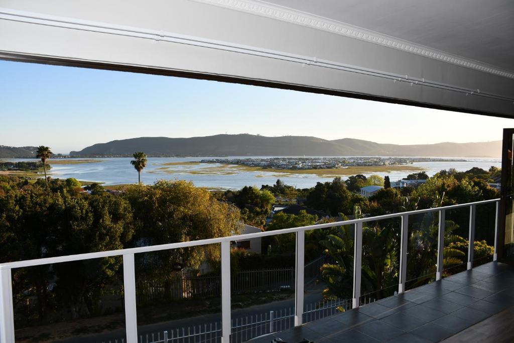 a view of a river from a balcony at Friendz Guesthouse in Knysna