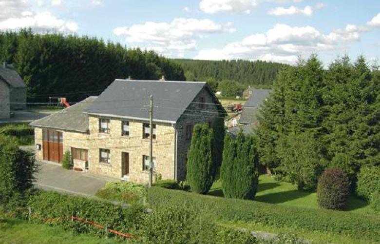 a large brick house with a black roof at La porte des fagnes in Malmedy