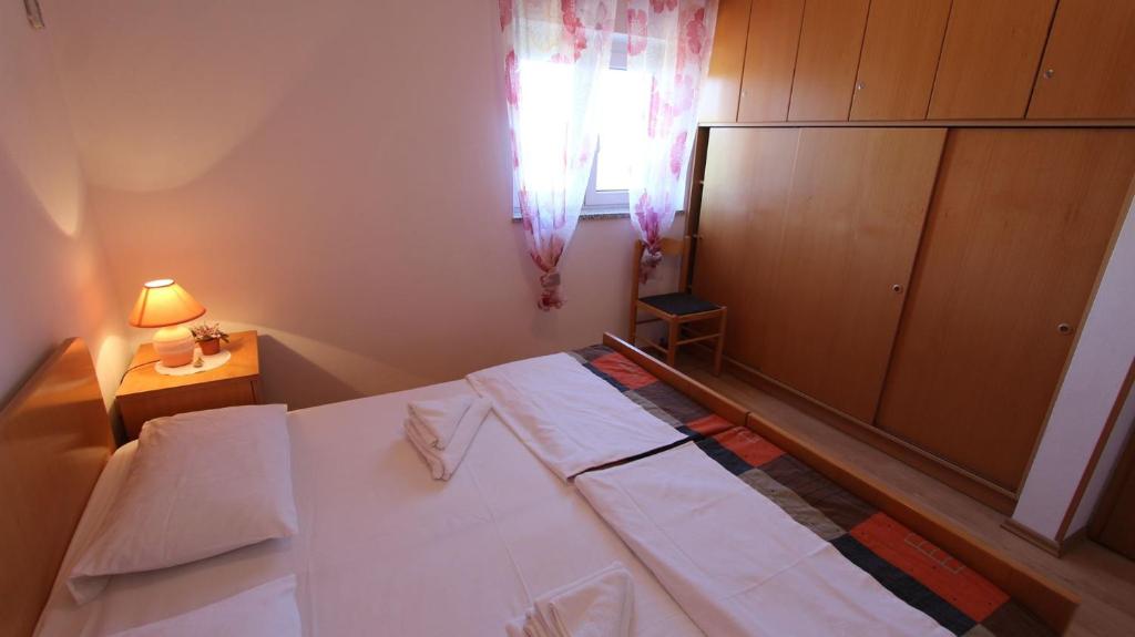 Postel nebo postele na pokoji v ubytování Apartments Damir