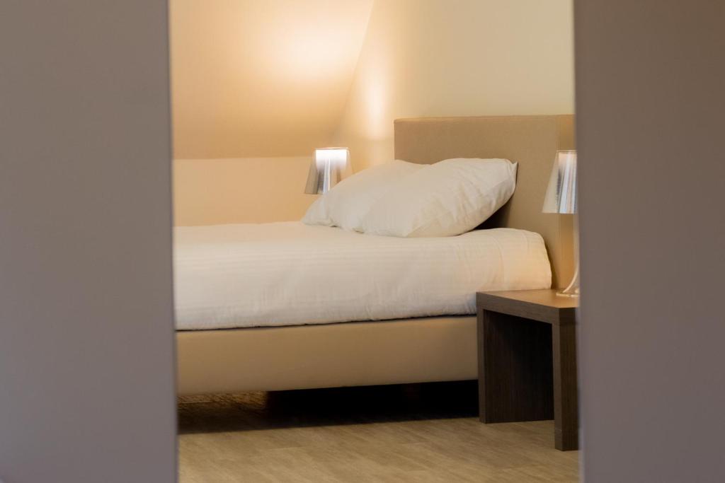 Postel nebo postele na pokoji v ubytování Hotel Soret