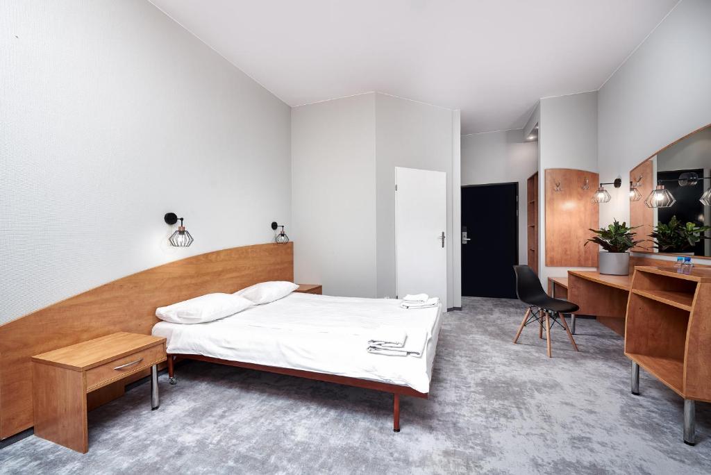 Postel nebo postele na pokoji v ubytování Hotel Anton by DNS