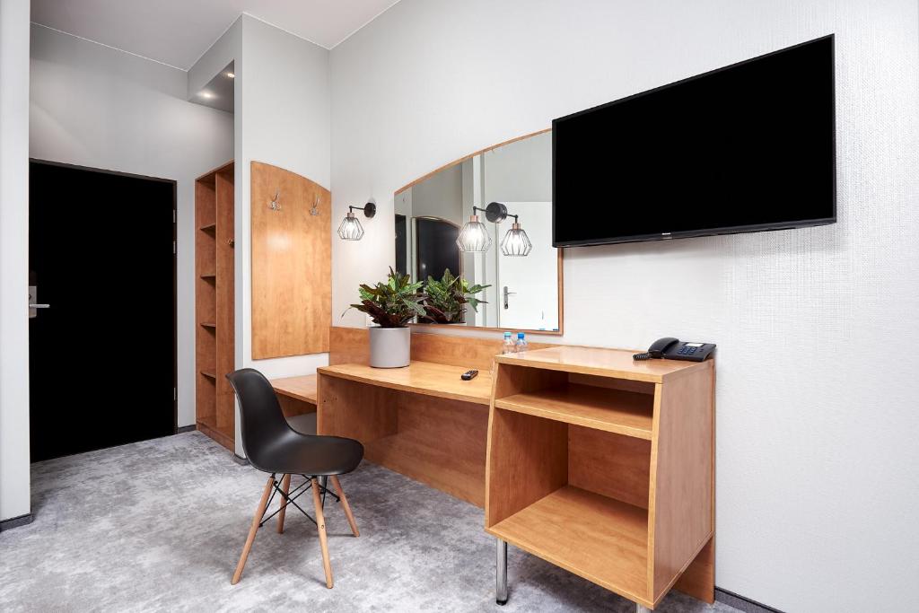 TV a/nebo společenská místnost v ubytování Hotel Anton by DNS