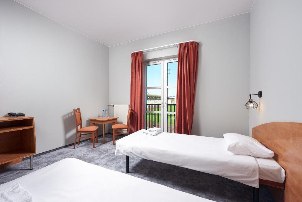 Postel nebo postele na pokoji v ubytování Hotel Anton by DNS