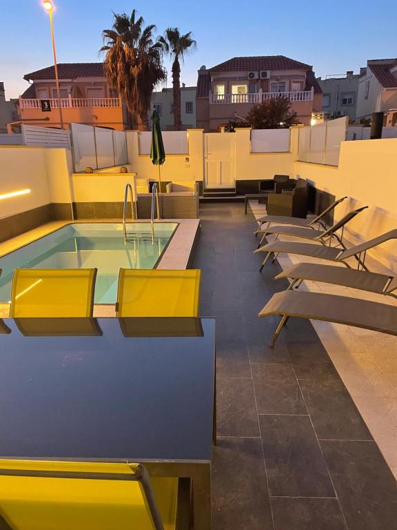 a pool on the roof of a building at Boulevard La Zenia Villa in Playa Flamenca