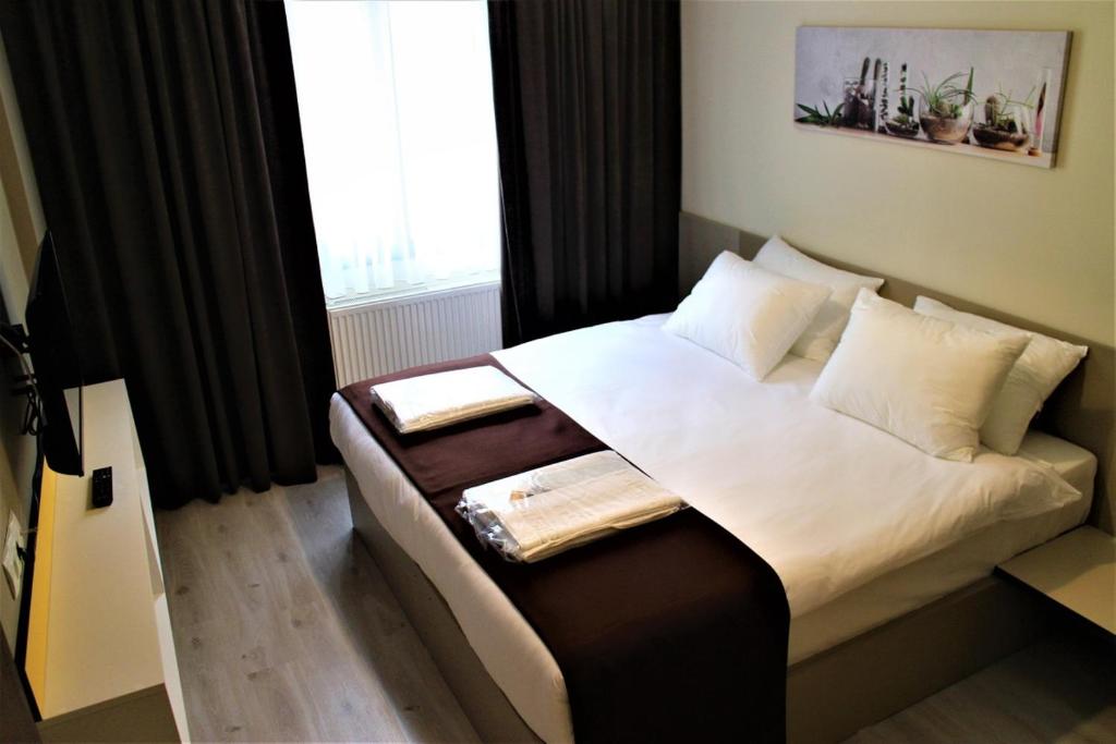 Postel nebo postele na pokoji v ubytování Moda Hotel