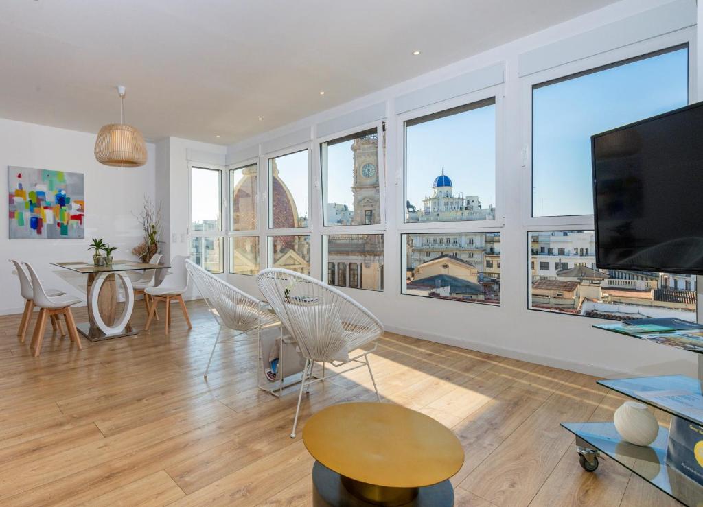 a living room with a view of a city at Ayuntamiento Panoramic in Valencia