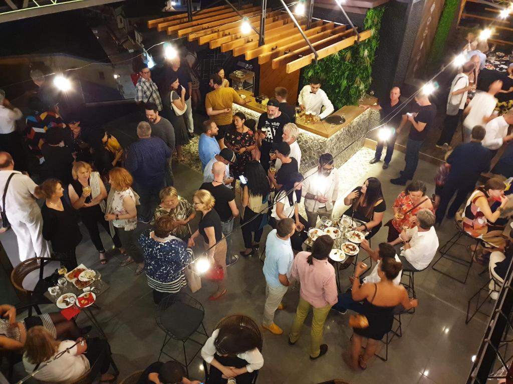 an overhead view of a crowd of people at a party at Hotel Arka in Skopje