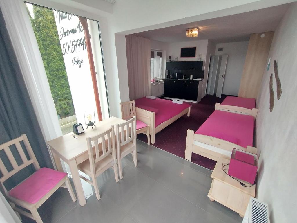 Posteľ alebo postele v izbe v ubytovaní Apartamenty nad jeziorem charzykowskim Villa Emilia