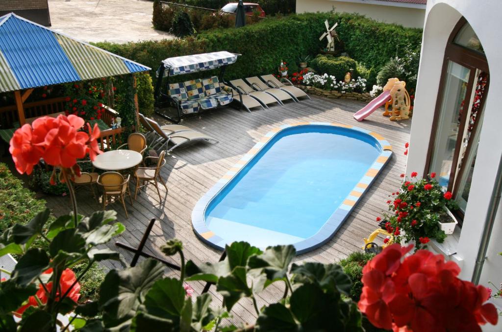 a model of a backyard with a swimming pool at Po Kastonu & SPA in Palanga