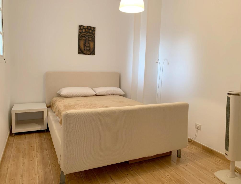 Postel nebo postele na pokoji v ubytování Beach Apartment