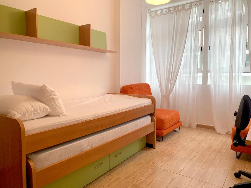 Postel nebo postele na pokoji v ubytování Beach Apartment