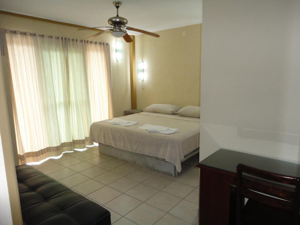 Postel nebo postele na pokoji v ubytování Hotel Catala