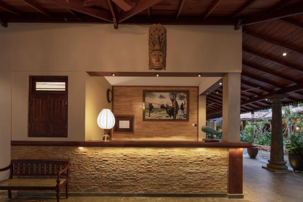 a lobby of a resort with a reception desk at Green Escape Unawatuna in Unawatuna