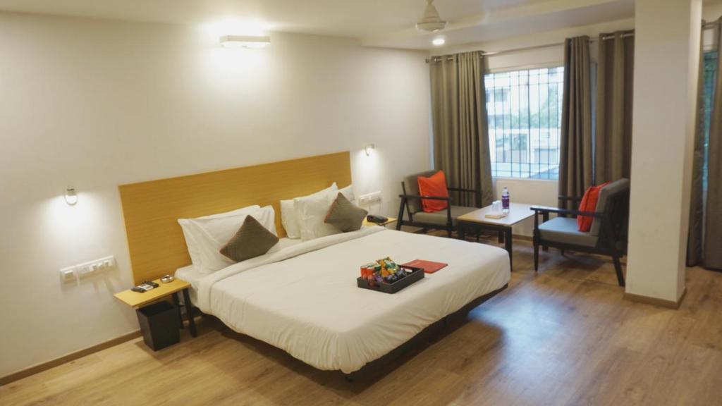 Postel nebo postele na pokoji v ubytování Hotel Maitrayee