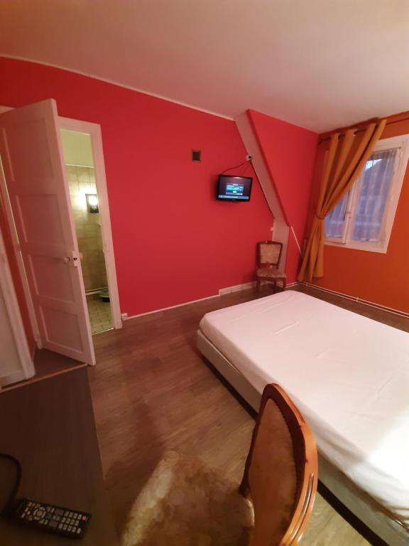 TV a/nebo společenská místnost v ubytování Hotel du Cygne